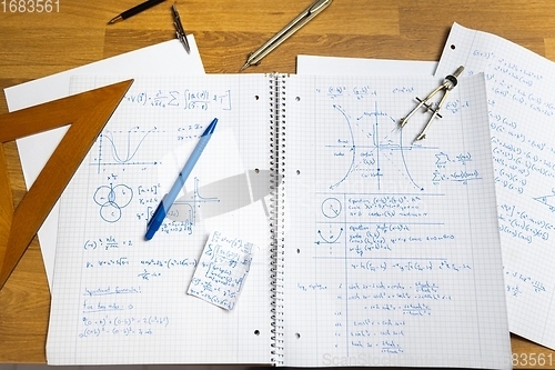 Image of Math exersize in white notebook closeup