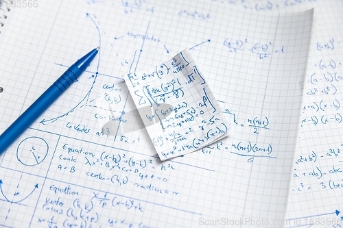 Image of Math exersize in white notebook closeup