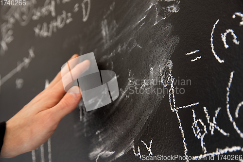 Image of Mathematical formulas on dark black chalk board