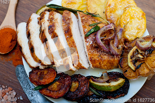 Image of roasted grilled BBQ chicken breast with herbs and spices 