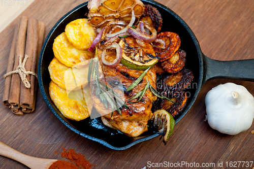 Image of roasted grilled BBQ chicken breast with herbs and spices 