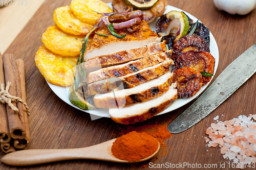 Image of roasted grilled BBQ chicken breast with herbs and spices 