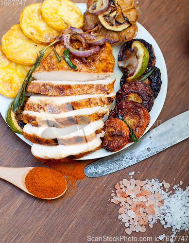 Image of roasted grilled BBQ chicken breast with herbs and spices 