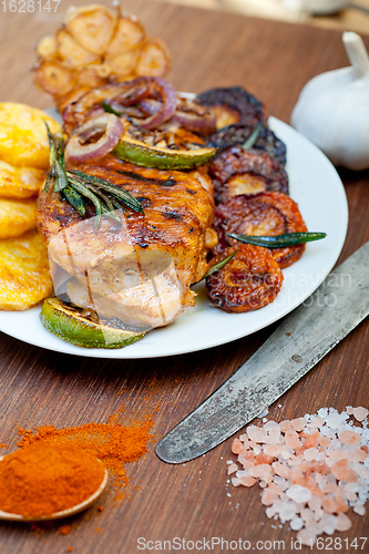 Image of roasted grilled BBQ chicken breast with herbs and spices 