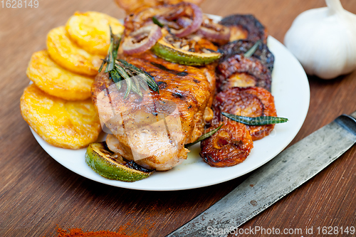 Image of roasted grilled BBQ chicken breast with herbs and spices 