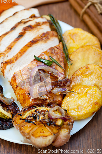 Image of roasted grilled BBQ chicken breast with herbs and spices 