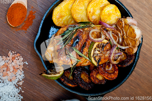Image of roasted grilled BBQ chicken breast with herbs and spices 