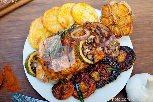 Image of roasted grilled BBQ chicken breast with herbs and spices 