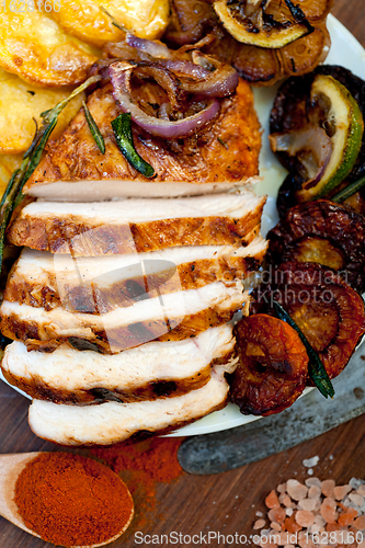 Image of roasted grilled BBQ chicken breast with herbs and spices 