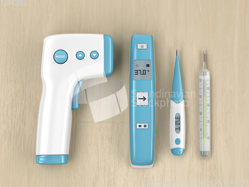 Image of Medical thermometers on wood table