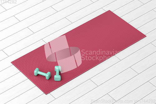 Image of Dumbbells and red fitness mat
