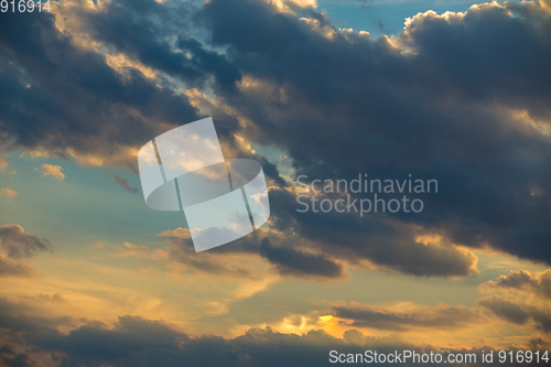 Image of sunset clouds on evening blue sky