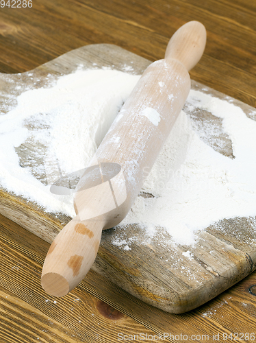 Image of flour on wooden board