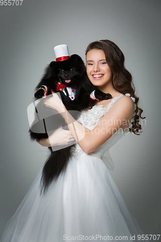 Image of bride girl with spitz goom in wedding suit