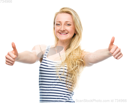 Image of Young woman is showing thumb up gesture