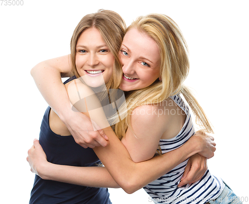 Image of Two young women are hugging as a best friends
