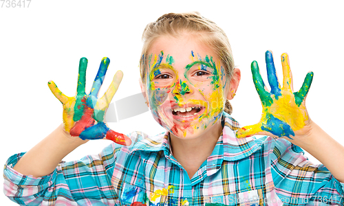 Image of Portrait of a cute girl playing with paints