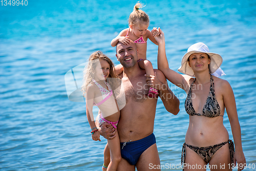 Image of portrait of happy family with kids during summer vacation