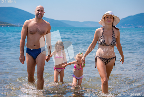 Image of portrait of happy family with kids during summer vacation