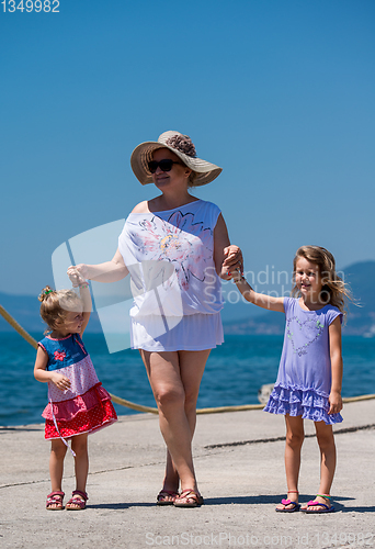 Image of Portrait of a grandmother with her cute little granddaughters by