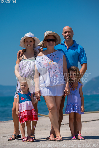 Image of Portrait of happy multi generation family by the sea