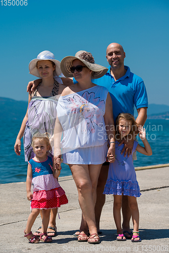 Image of Portrait of happy multi generation family by the sea