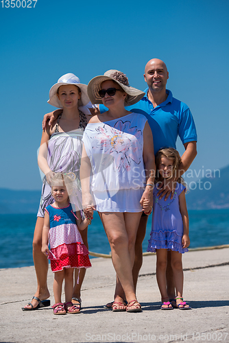 Image of Portrait of happy multi generation family by the sea