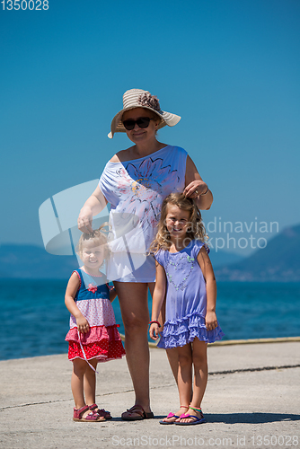 Image of Portrait of a grandmother with her cute little granddaughters by