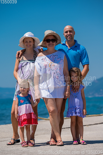 Image of Portrait of happy multi generation family by the sea