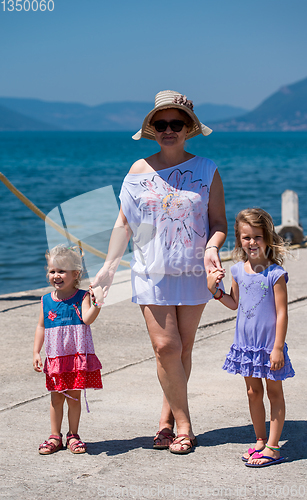 Image of Portrait of a grandmother with her cute little granddaughters by