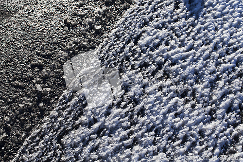 Image of Asphalt road under the snow