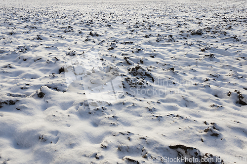 Image of covered with snow plowed earth