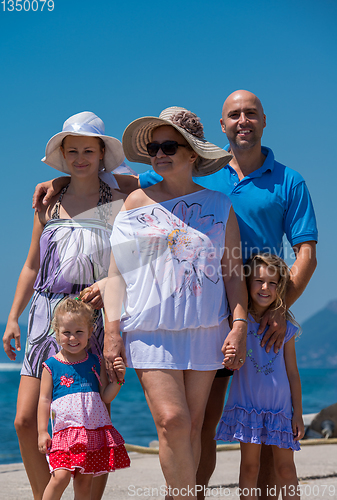 Image of Portrait of happy multi generation family by the sea