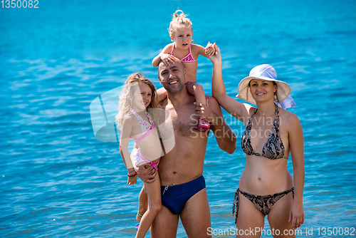 Image of portrait of happy family with kids during summer vacation