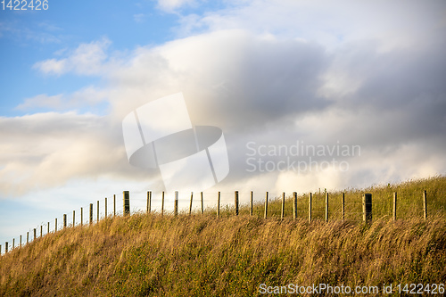 Image of hill with a fence nature background