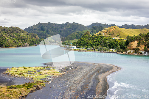 Image of sea shore rocks and mount Taranaki, New Zealand