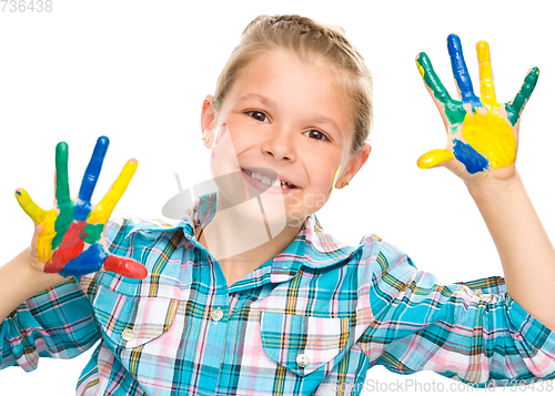 Image of Portrait of a cute girl playing with paints