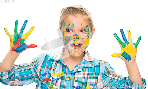 Image of Portrait of a cute girl playing with paints