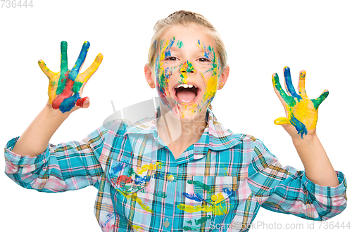 Image of Portrait of a cute girl playing with paints