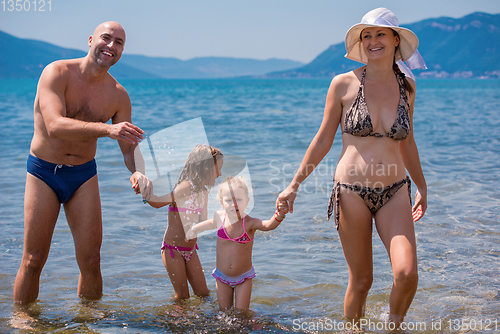 Image of portrait of happy family with kids during summer vacation