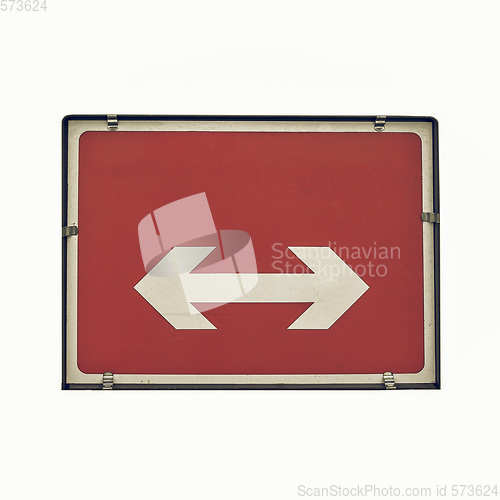 Image of Vintage looking Direction arrow sign isolated