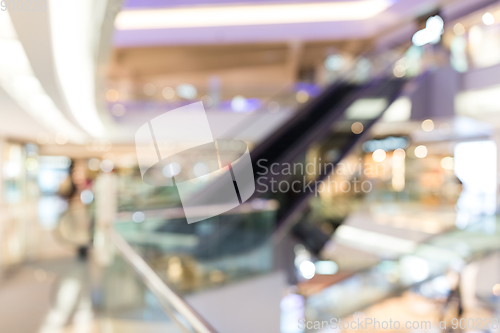 Image of Blurred image of people in shopping mall with bokeh