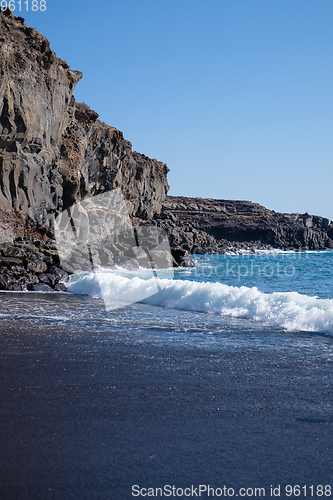 Image of beautiful wild beach with black sand