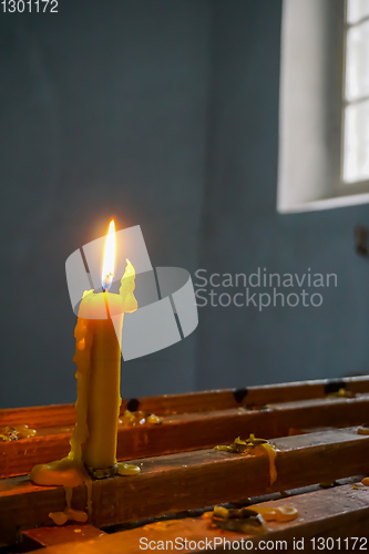 Image of Burning candle at Koknese Evangelical Lutheran Church.