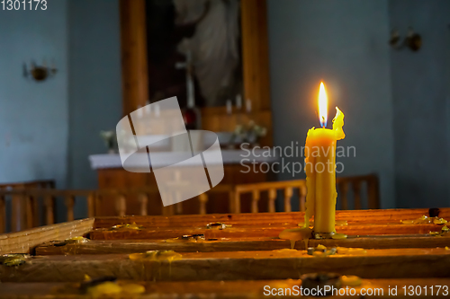 Image of Burning candle at Koknese Evangelical Lutheran Church.