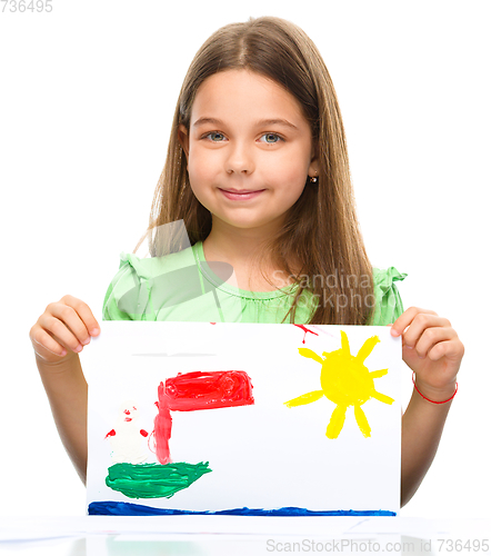 Image of Little girl is showing her painting