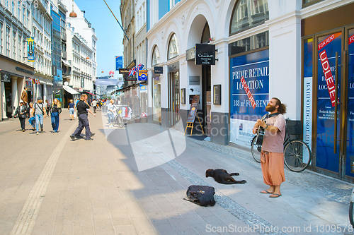 Image of Street musician perform play. Copenhagen 