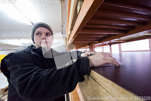 Image of carpenter writing a receipt