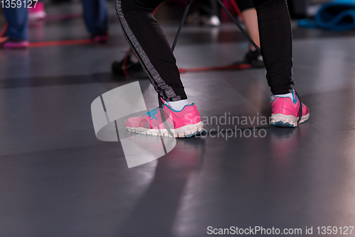 Image of sporty women exercising with a rubber bands