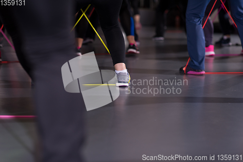 Image of sporty women exercising with a rubber bands